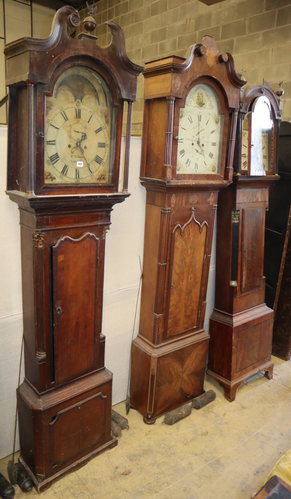 Three George III oak and mahogany longcase clocks